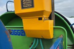 This is a PWM Powder Master dry inoculant applicator on a ag bagger machine.